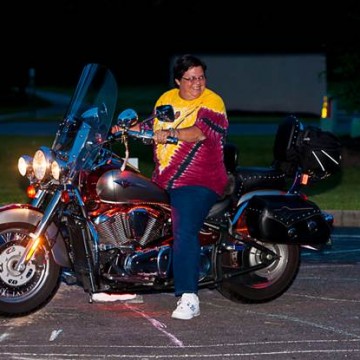 Woman Riding Motorcycle at Night