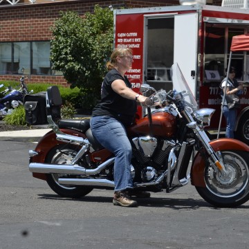 Motorcycle Rally – Woman Sitting on Bike