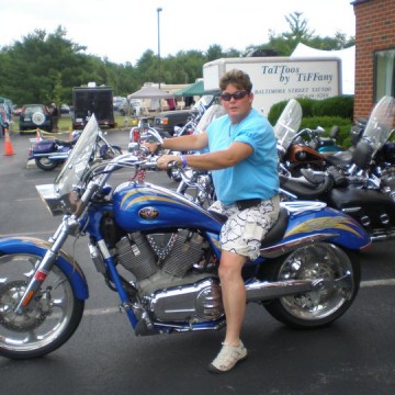 Woman Riding Blue Motorcycle