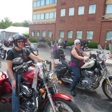 Women Riding Motorcycles at Rally